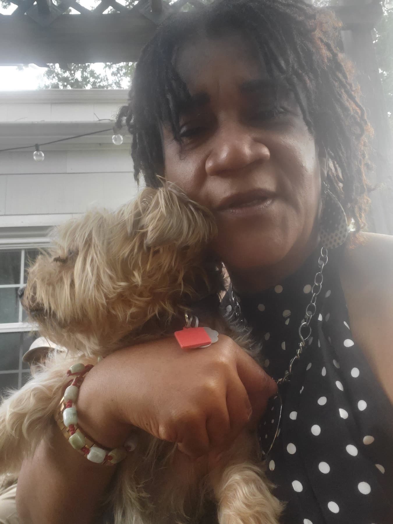 Caregiver photographed outdoors during a family care moment