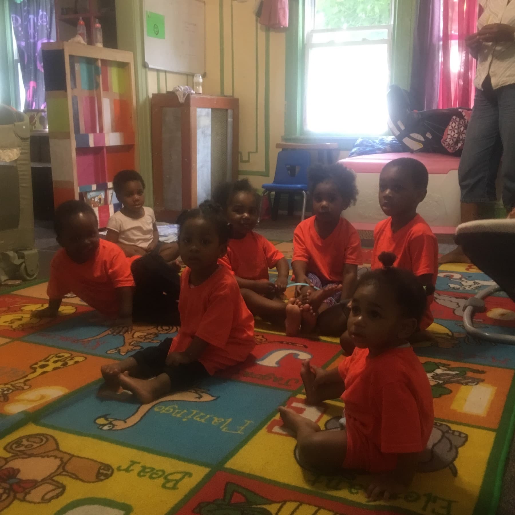 Children gathered together on a classroom rug