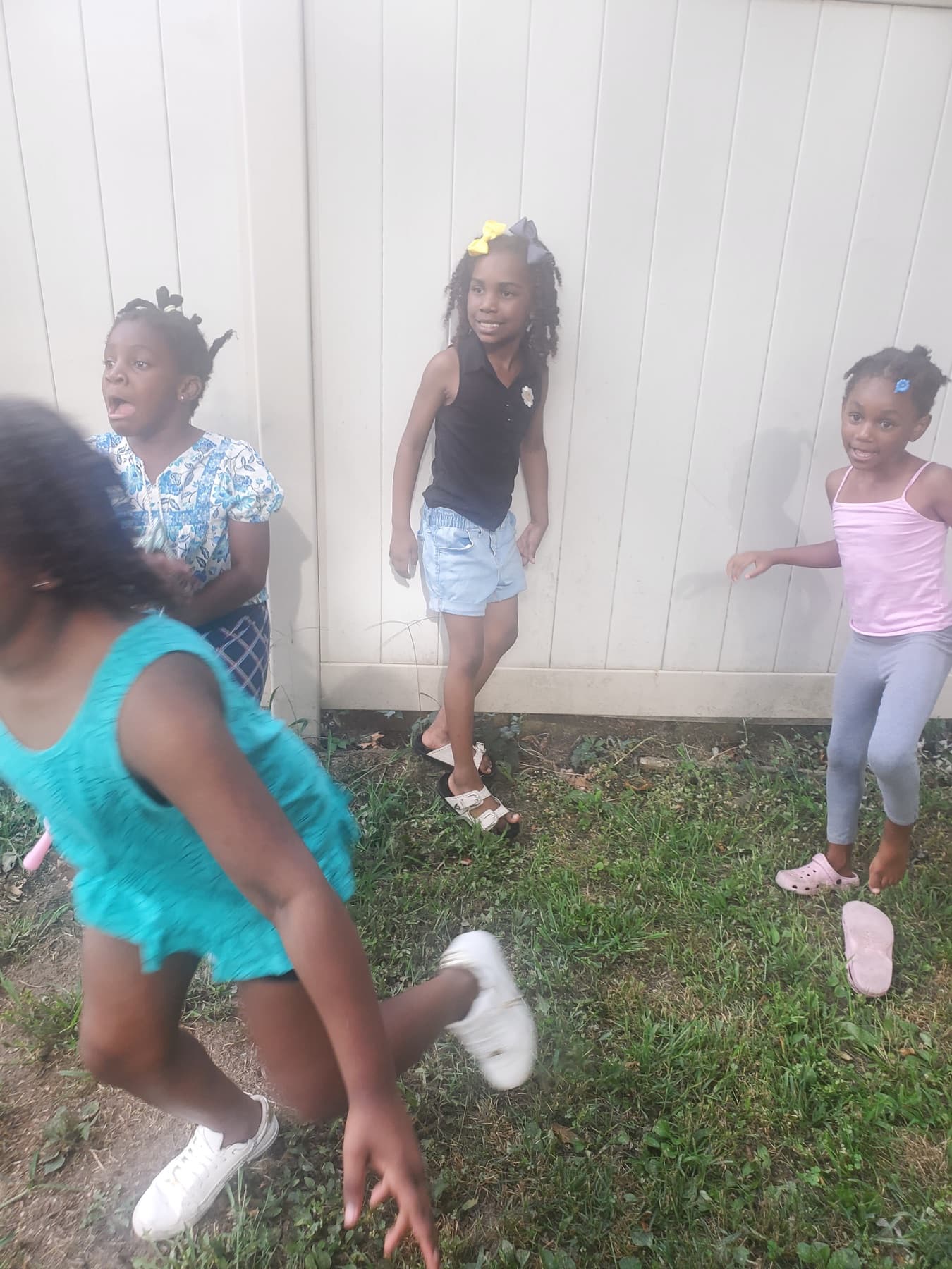 Children playing outside in the yard