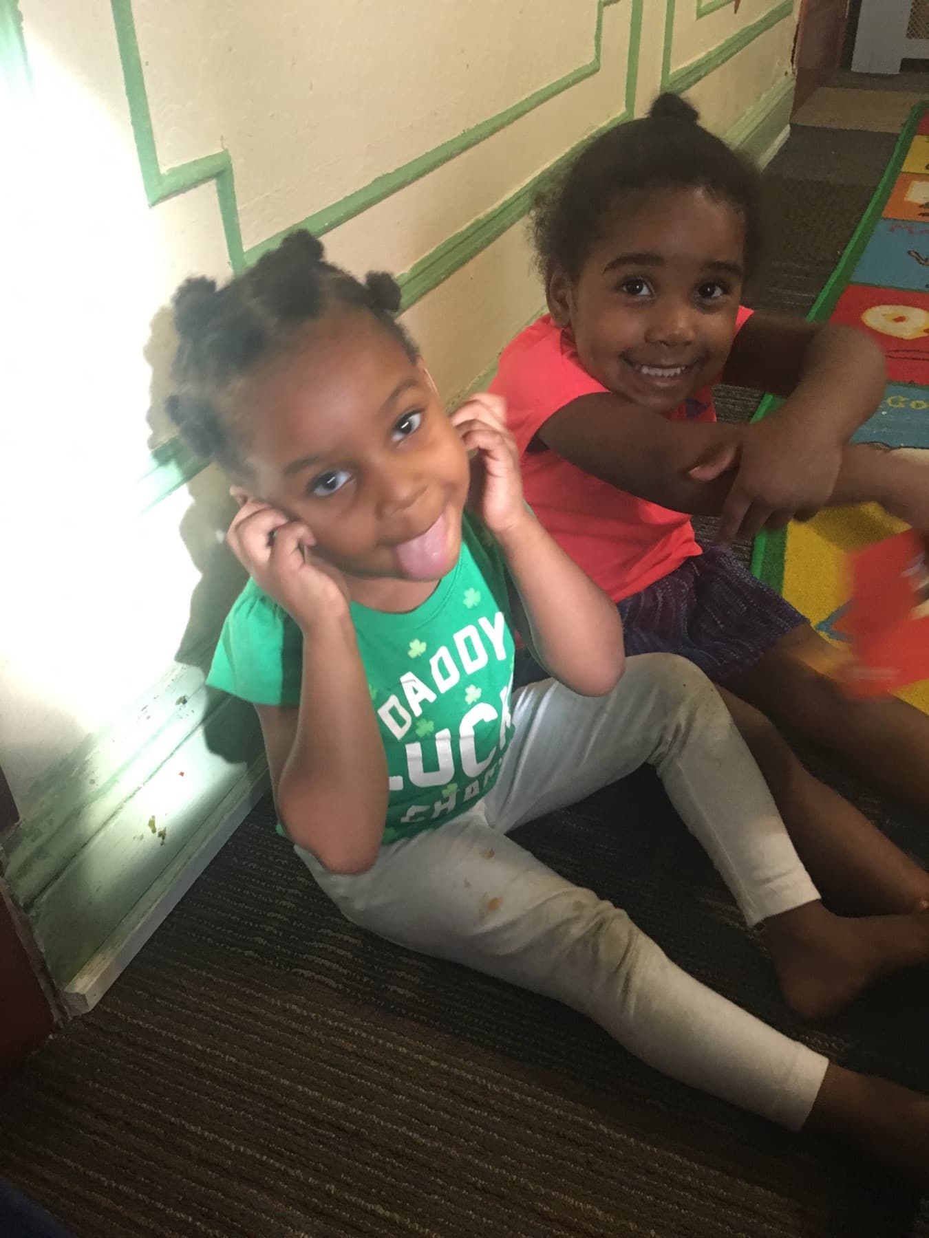 Children smiling together during the daycare day