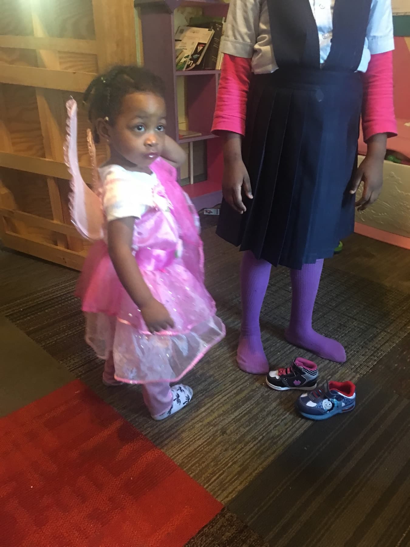 Child in a dress-up costume during classroom play