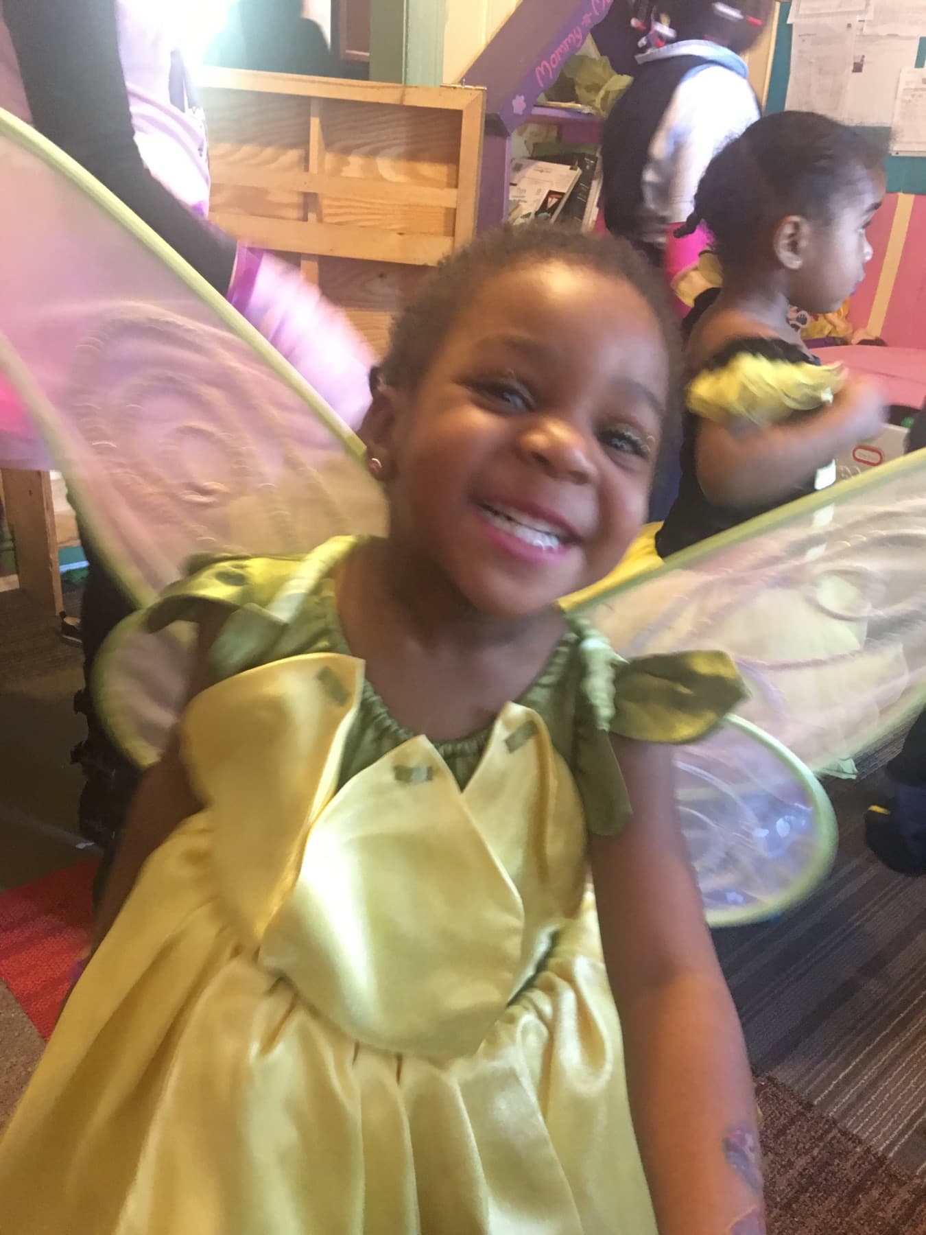 Child smiling during daycare costume day