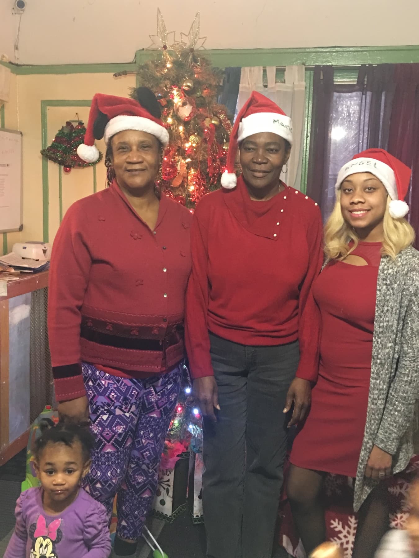 Daycare staff and children during a holiday celebration