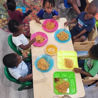 Children seated together for a meal